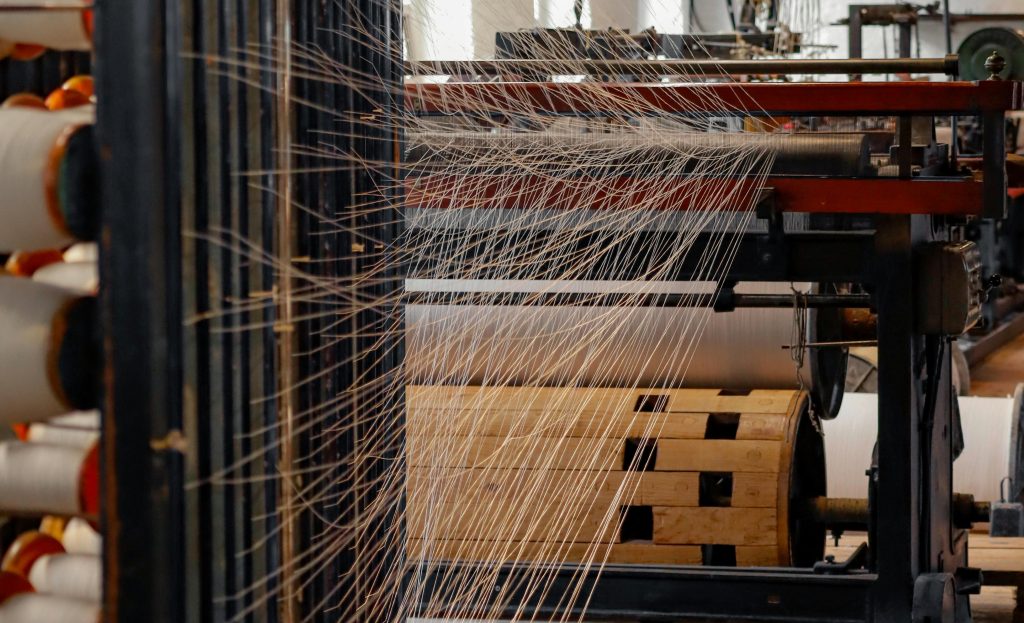 Yarn weaving machine in a clothing factory